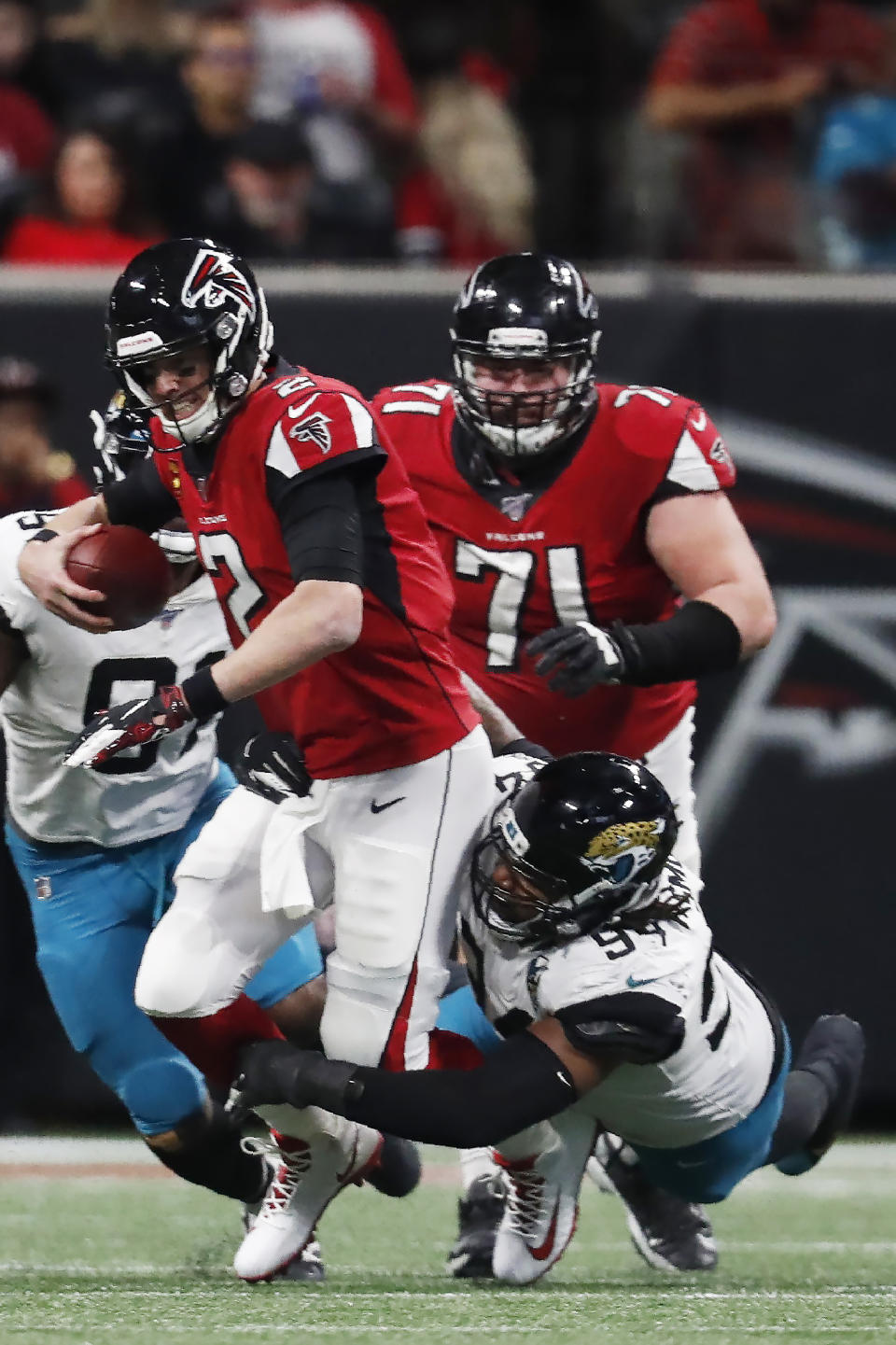Atlanta Falcons quarterback Matt Ryan (2) is sacked by Jacksonville Jaguars defensive end Dawuane Smoot (94) during the second half of an NFL football game, Sunday, Dec. 22, 2019, in Atlanta. (AP Photo/John Bazemore)