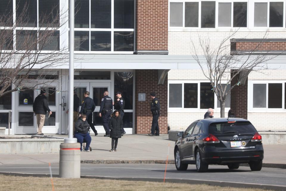 Monroe County Sheriff's Office responded with assistance from the Rochester Police to the schools in Hilton after a bomb threat was made alleging there were explosive devices placed in all the schools .  The two police agencies go inside briefly before getting their dogs.