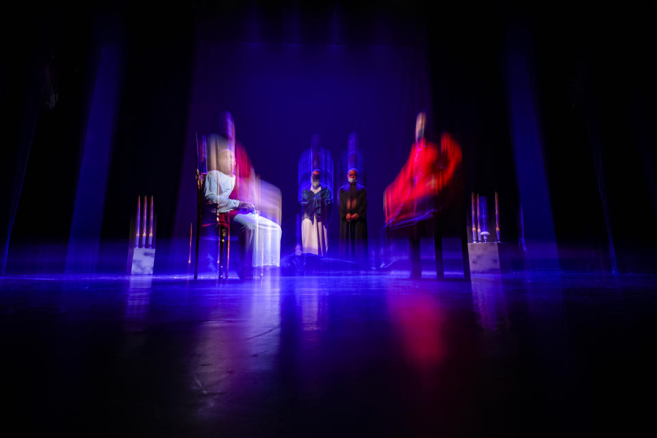 Inmates perform during the final rehearsal of the State of Siege, by French author Albert Camus, a play describing the arrival of plague in Spain which brings a totalitarian regime to power, at the Nottara Theatre in Bucharest, Romania, Wednesday, Nov. 24, 2021. (AP Photo/Andreea Alexandru)