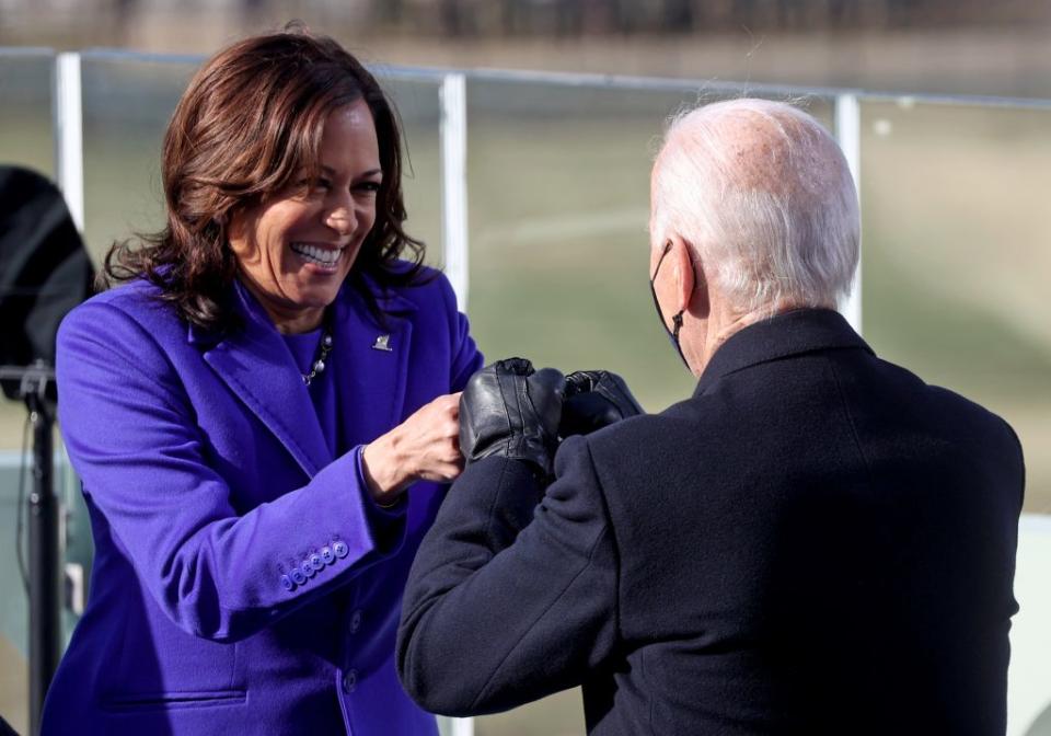 Vice President Kamala Harris fist bumps President-elect Joe Biden after she was sworn in at their inauguration on the West Front of the U.S. Capitol on January 20, 2021 in Washington, DC. (Photo by Jonathan Ernst-Pool/Getty Images)