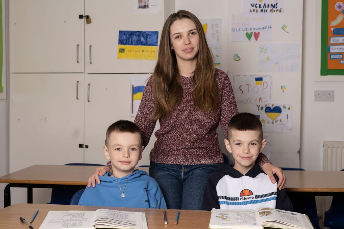 Tetiana Bohatynska pictured with her sons Danylo, 5, and Oleh, 8, at St Mary’s Ukrainian School  (Daniel Hambury)