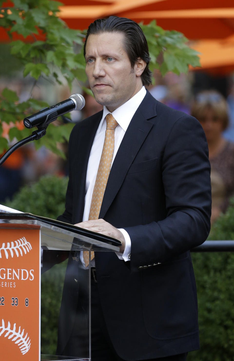 FILE - Lou Angelos, son of Baltimore Orioles majority owner Peter Angelos, speaks at a ceremony before a baseball game between the Orioles and the Boston Red Sox in Baltimore on Sept. 29, 2012. Orioles CEO John Angelos was accused in a lawsuit in June 2022 of seizing control of the team at the expense of his brother Lou, and in defiance of their father Peter’s wishes. (AP Photo/Patrick Semansky, File)