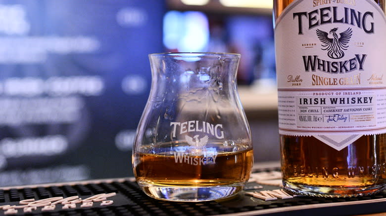 teeling whiskey glass and bottle