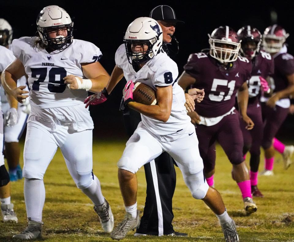 Parrish Community quarterback Jackson Volz dashes up field against Braden River on Friday night. Volz had a solid game passing the ball in the Bulls' loss.