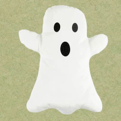 A novelty ghost throw pillow