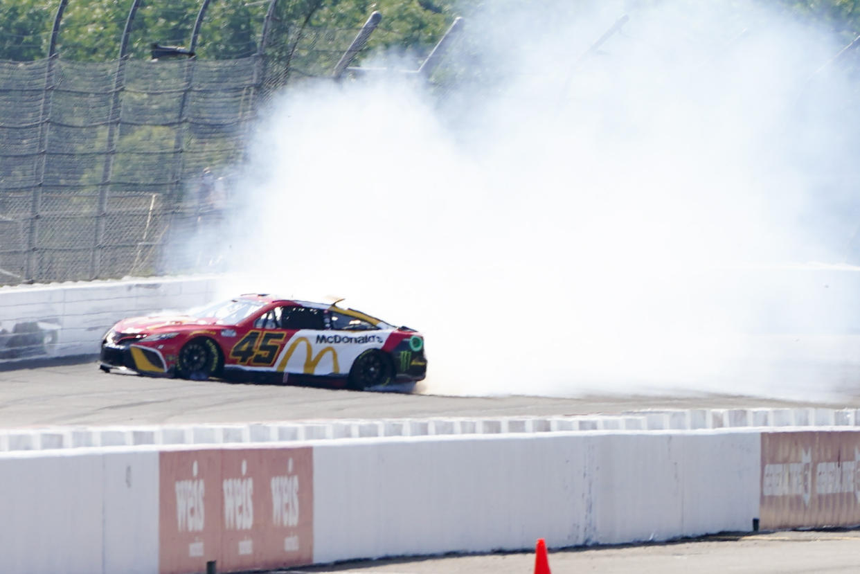 Kurt Busch (45) spins as he takes part in qualifying for the NASCAR Cup Series at Pocono Raceway, Saturday, July 23, 2022 in Long Pond, Pa. (AP Photo/Matt Slocum)