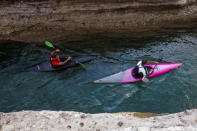 Kayakers paddle through the Cijevna River canyon during a protest, in the village Dinosa, near Tuzi, Montenegro, October 20, 2018. REUTERS/Stevo Vasiljevic