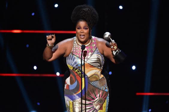 Lizzo accepts her prize for Entertainer of the Year (Getty Images for BET)