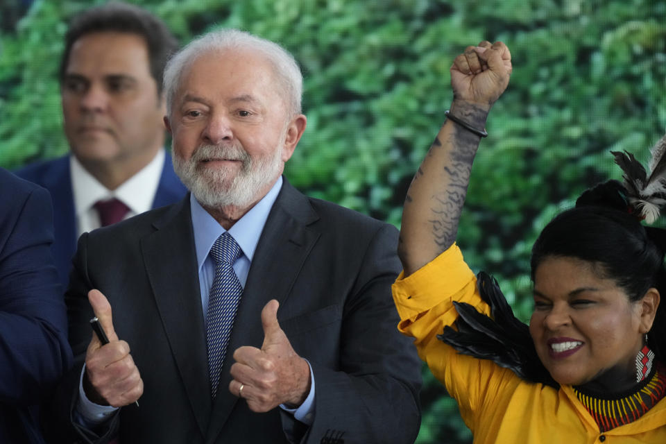 Brazil's President Luiz Inacio Lula da Silva gestures a thumbs-up with both hands as he stands next to the Minister of Indigenous Peoples Sonia Guajajara, during a ceremony to commemorate Amazon Day, in Brasilia, Brazil, Tuesday, Sept. 5, 2023. (AP Photo/Eraldo Peres)