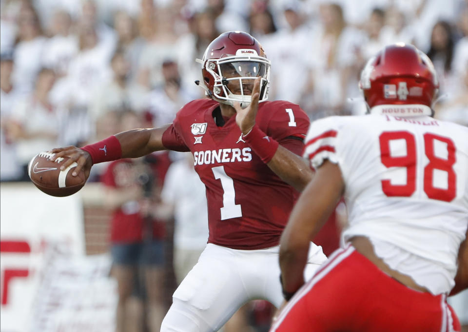 Oklahoma quarterback Jalen Hurts (1) passes the ball against Houston during the first half of an NCAA college football game in Norman, Okla., Sunday, Sept. 1, 2019. (AP Photo/Alonzo Adams)