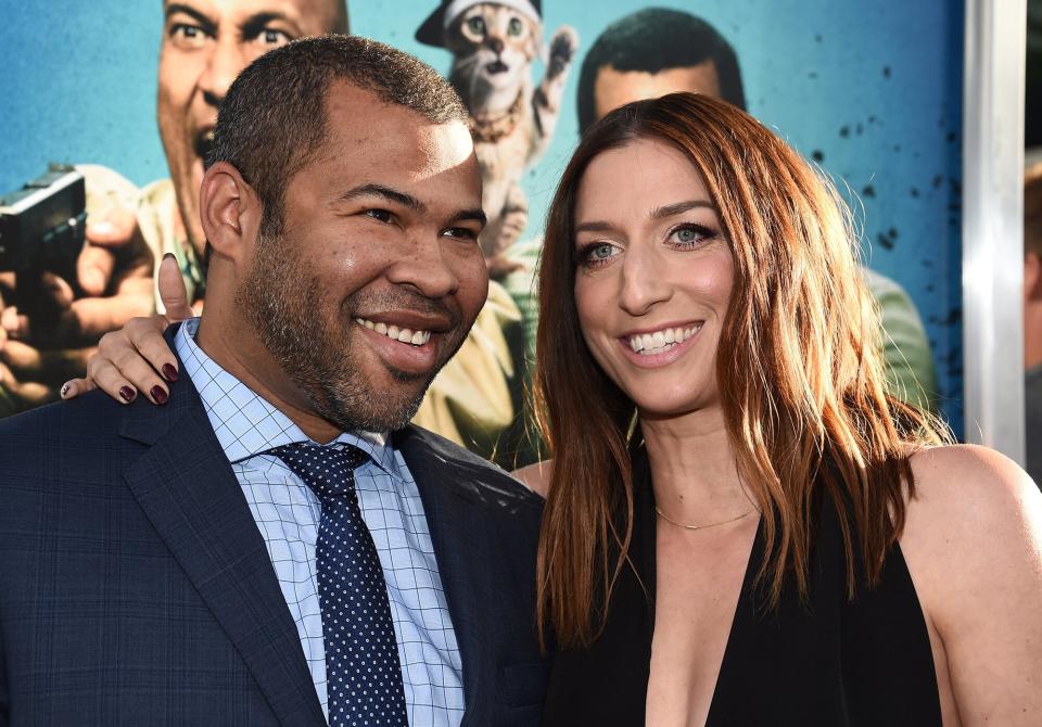 Jordan Peele (L) and actress Chelsea Peretti arrive at the premiere of Warner Bros.' "Keanu" at the ArcLight Cinemas Cinerama Dome on April 27, 2016 in Hollywood, California