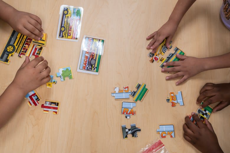 Students work on puzzles in the transitional kindergarten program at Westwood Elementary School in Stockton on Sept. 22, 2023. Photo by Loren Elliott for CalMatters