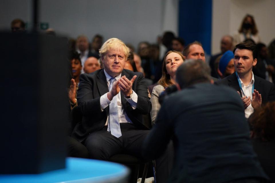 Prime Minister Boris Johnson applauds as Chancellor Rishi Sunak speaks at the Conservative Party conference in Manchester (Peter Byrne/PA) (PA Wire)