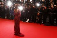 Singer Cheryl Cole poses on the red carpet as she arrives for a film screening during the 66th Cannes Film Festival in Cannes in this May 18, 2013 file picture. REUTERS/Yves Herman/Files