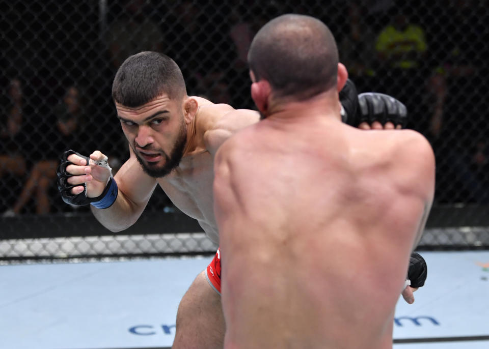 LAS VEGAS, NEVADA – JANUARY 15: (L-R) Ramiz Brahimaj punches Court McGee in their welterweight fight during the UFC Fight Night event at UFC APEX on January 15, 2022 in Las Vegas, Nevada. (Photo by Jeff Bottari/Zuffa LLC via Getty Images)