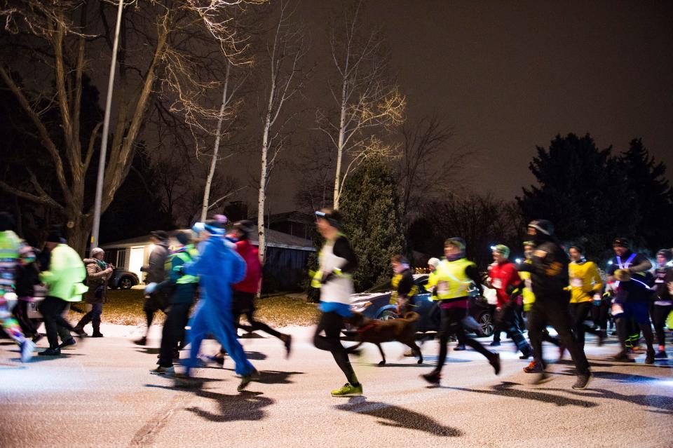 Runners begin the Resolution Run 5K at Our Saviour's Lutheran Church on December 31, 2018. People braved single-digit temperatures to ring in the new year with the run. 