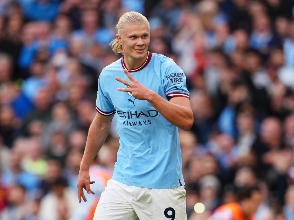 Erling Haaland of Manchester City celebrates their sides fifth goal and their hat trick during the Premier League match between Manchester City and Manchester United at Etihad Stadium.