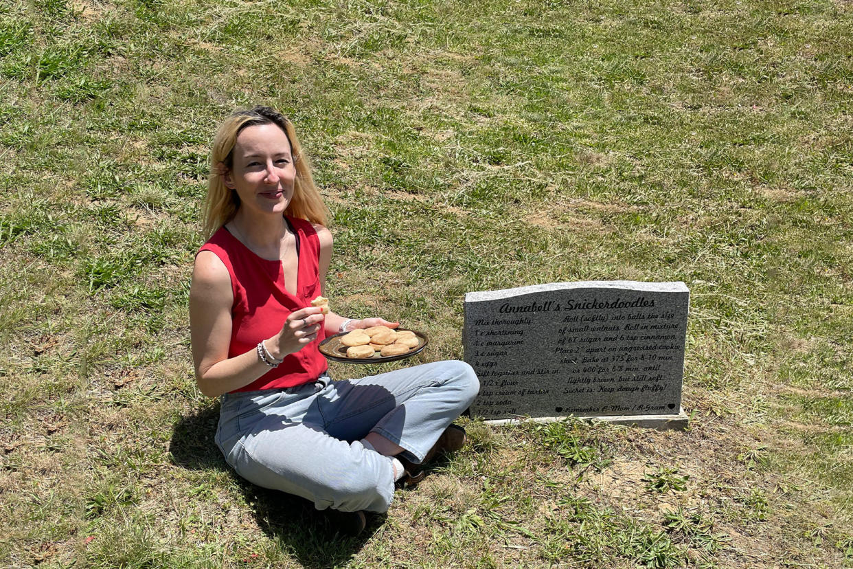 Rosie Grant sitting by the gravestone of Annabell Gunderson Photo courtesy of Rosie Grant