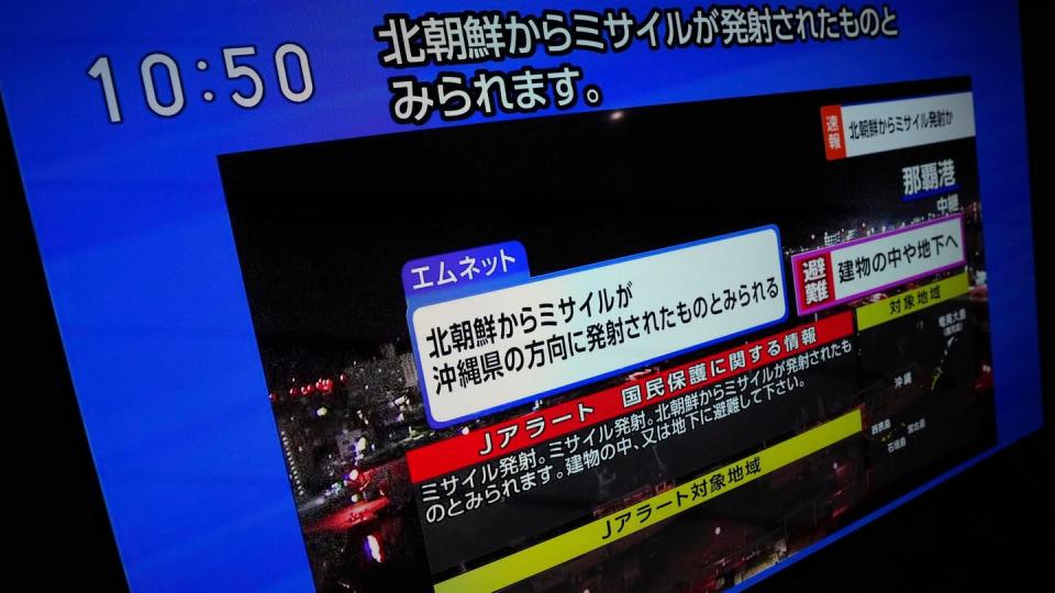 A TV shows a J-Alert, or National Early Warning System, to Japanese residents Tuesday, Nov. 21, 2023, in Tokyo. (Eugene Hoshiko/AP)