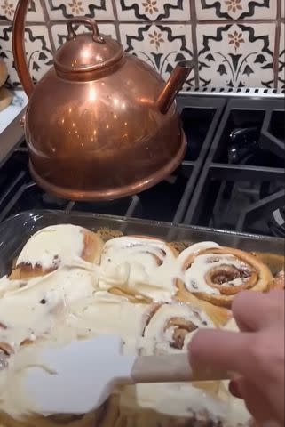 <p>YouTube/Taylor Swift</p> Taylor Swift cooks up some cinnamon rolls in her new YouTube clip.