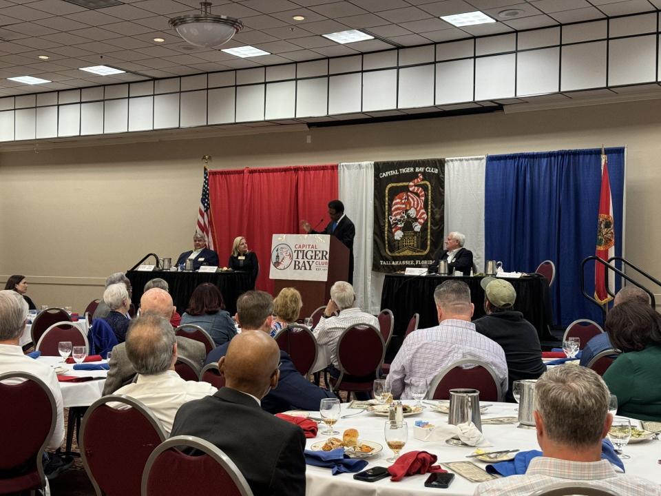 Leon County Commissioner Bill Proctor speaks to members of the Capitol Tiger Bay Club at a special meeting which looked to honor the commissioner.