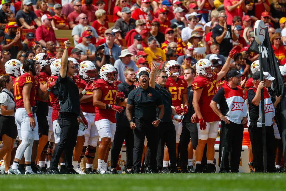 Iowa State strength and conditioning coach Freddie Walker celebrates a stop by the defense during the Iowa State, Southeast Missouri State game on Saturday