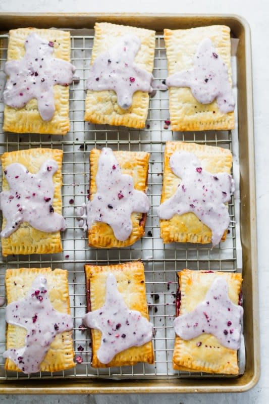 <p>Blue Bowl Recipes</p><p>These pop tarts are filled with a smooth blueberry jam, wrapped in a perfectly crisp, flaky pie crust, and topped with a drizzle of blueberry icing. They’re better than the store-bought ones!</p><p><strong>Get the recipe: <a href="https://bluebowlrecipes.com/homemade-blueberry-pop-tarts/" rel="nofollow noopener" target="_blank" data-ylk="slk:Blueberry Pop Tarts;elm:context_link;itc:0;sec:content-canvas" class="link rapid-noclick-resp"><em>Blueberry Pop Tarts</em></a></strong></p>