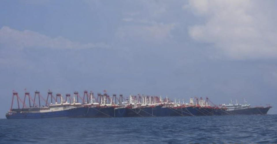 In this photo provided Sunday, March 21, 2021, by the Philippine Coast Guard/National Task Force-West Philippine Sea, some of the 220 Chinese vessels are seen moored at Whitsun Reef, South China Sea on March 7, 2021. The Philippine government expressed concern after spotting more than 200 Chinese fishing vessels it believed were crewed by militias at a reef claimed by both countries in the South China Sea, but it did not immediately lodge a protest. (Philippine Coast Guard/National Task Force-West Philippine Sea via AP)