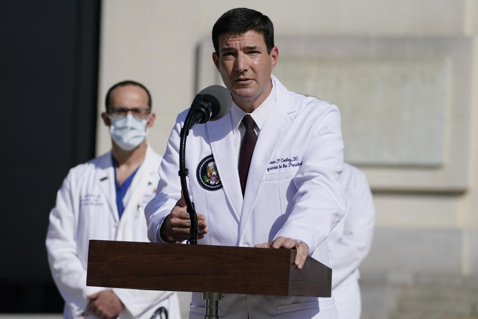 Dr. Sean Conley, physician to President Donald Trump, talks with reporters at Walter Reed National Military Medical Center, Monday, Oct. 5, 2020, in Bethesda, Md. (AP Photo/Evan Vucci)