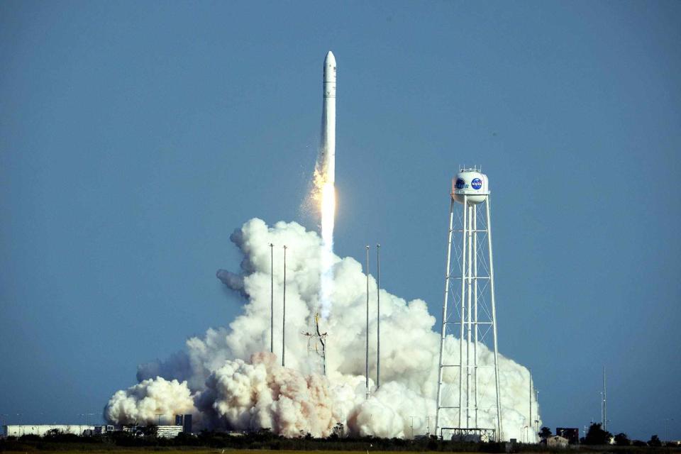 <p>Kevin Dietsch/Getty Images</p> A Northrop Grumman Antares rocket, carrying the Cygnus cargo spacecraft, launches from Pad-0A at NASA