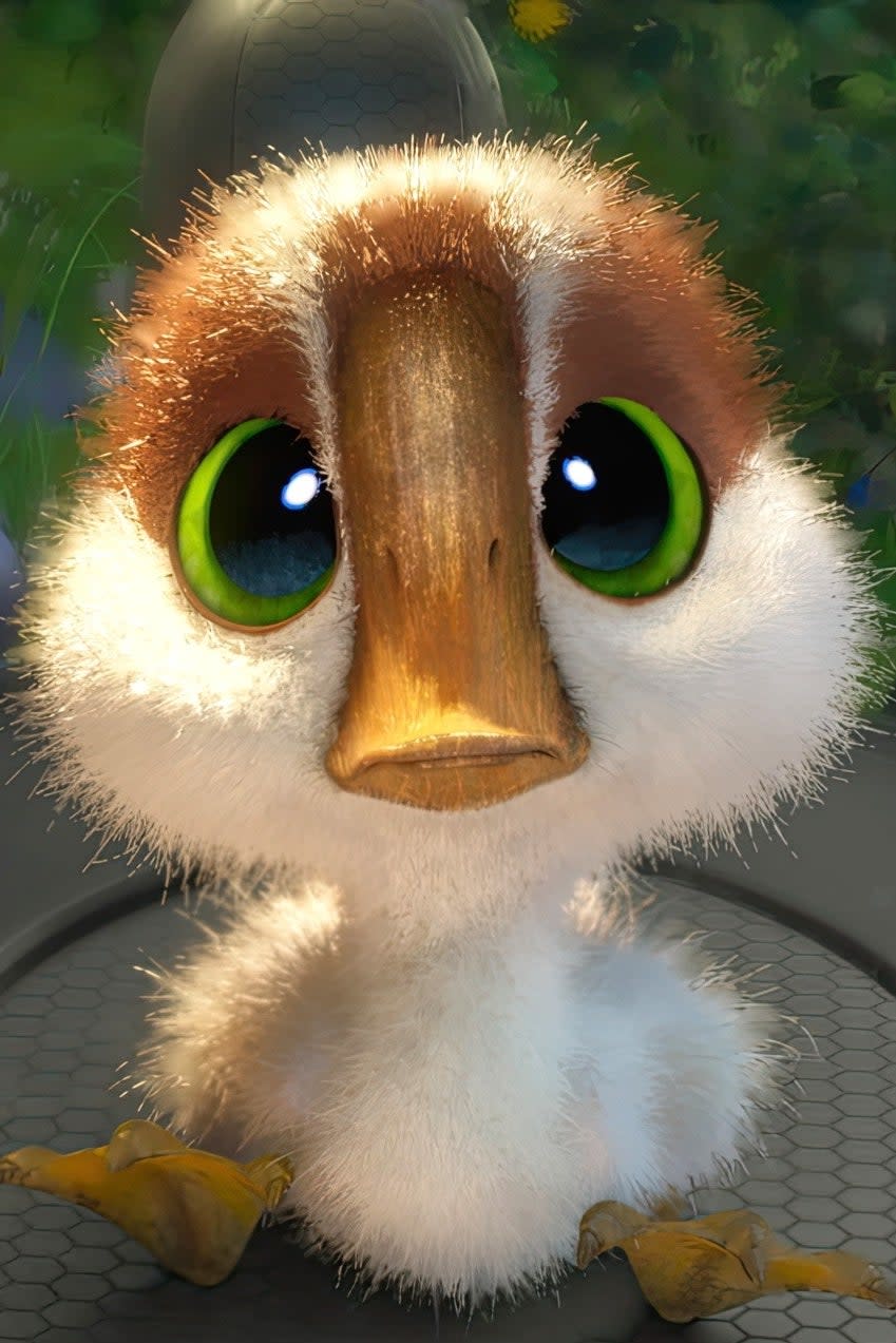 A cute animated duckling with big eyes is sitting on a gloved hand, surrounded by greenery