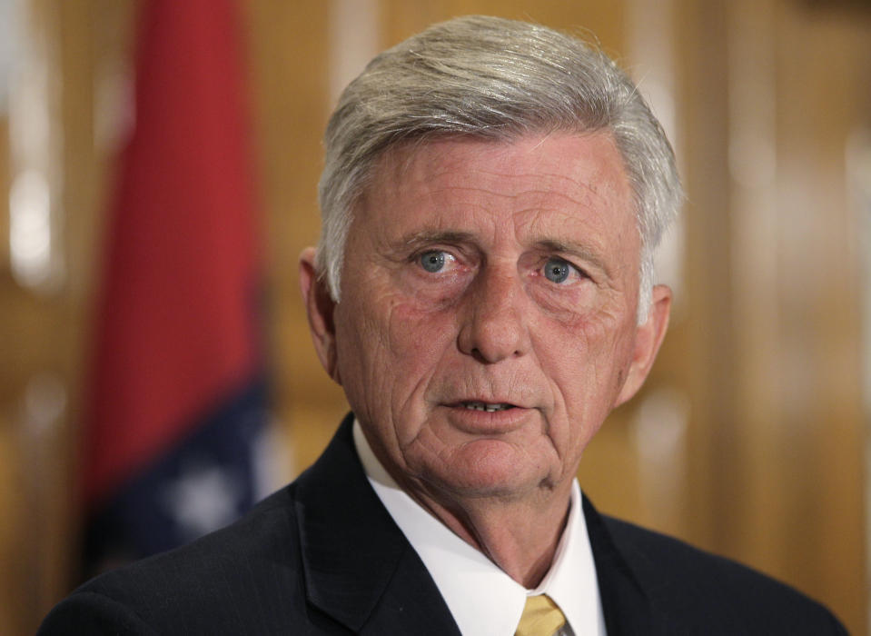 Arkansas Gov. Mike Beebe answers questions about the state's participation in the federal health care law at the Arkansas state Capitol in Little Rock, Ark., Monday, July 2, 2012. (AP Photo/Danny Johnston)