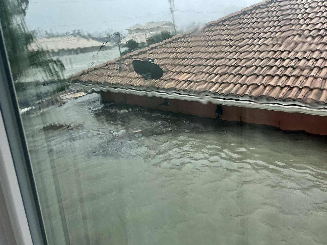A photograph of the storm surge reaching almost to the roof outside Carole McDanel's home in Fort Myers, Florida.  (Courtesy Beth Booker)