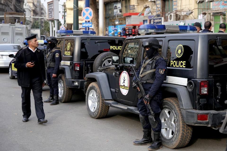 Egyptian riot police officers stand guard on Tahrir Square, Cairo to deter protesters on the sixth anniversary of the Arab Spring uprising: Stringer/AFP/Getty