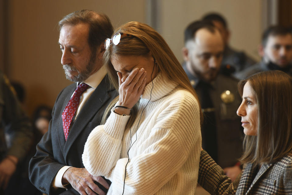 Michelle Troconis listens as a verdict of guilty on all counts is read on the final day jury deliberation for her criminal trial at Connecticut Superior Court in Stamford, Conn. Friday, March 1, 2024. Troconis was found guilty by the jury following a lengthy trial in which prosecutors laid out a case that she helped her then-boyfriend, Fotis Dolus, plot and cover up the killing of his estranged wife, Jennifer Dulos, as they battled each other in divorce and child custody proceedings. (Ned Gerard/Hearst Connecticut Media via AP, Pool)