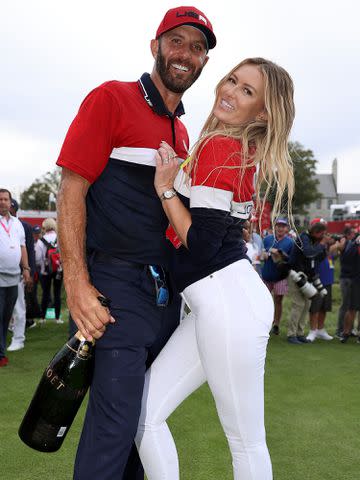 <p>Warren Little/Getty</p> Dustin Johnson and Paulina Gretzky during Sunday Singles Matches of the 43rd Ryder Cup on September 26, 2021 in Kohler, Wisconsin.