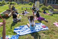 Francesca Martilotta teaches a fourth grade English class outdoors during the coronavirus outbreak at the Osborn School, Tuesday, Oct. 6, 2020, in Rye, N.Y. (AP Photo/Mary Altaffer)