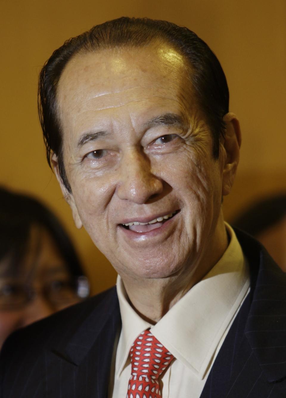 FILE - In this July 16, 2008 file photo, Macau casino mogul Stanley Ho is shown at the Hong Kong Stock Exchange in Hong Kong. On Tuesday, May 26, 2020, the family of Stanley Ho, the Macao casino tycoon considered the father of modern gambling in China, has died at 98. (AP Photo/Vincent Yu, File)