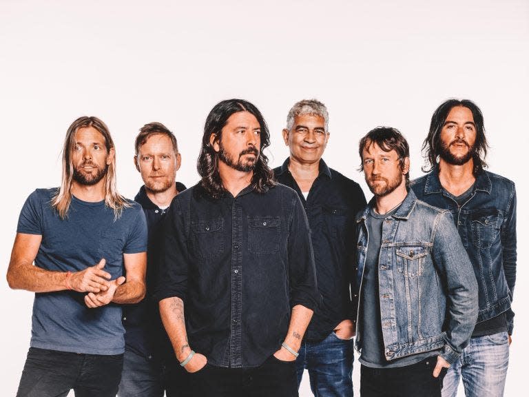 Dave Grohl, center, and members of Seattle-born rock band Foo Fighters.