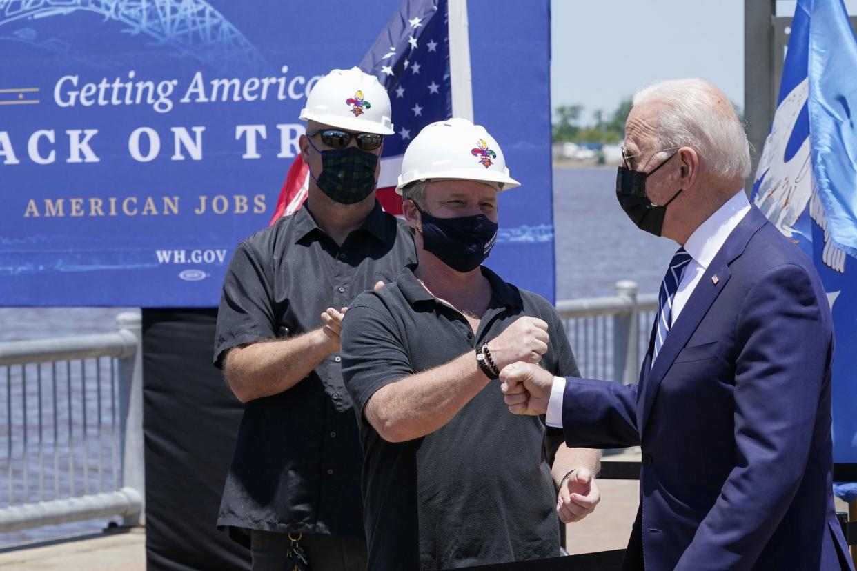 President Joe Biden greets people as he arrives to speak Thursday, May 6, in Lake Charles, La. 