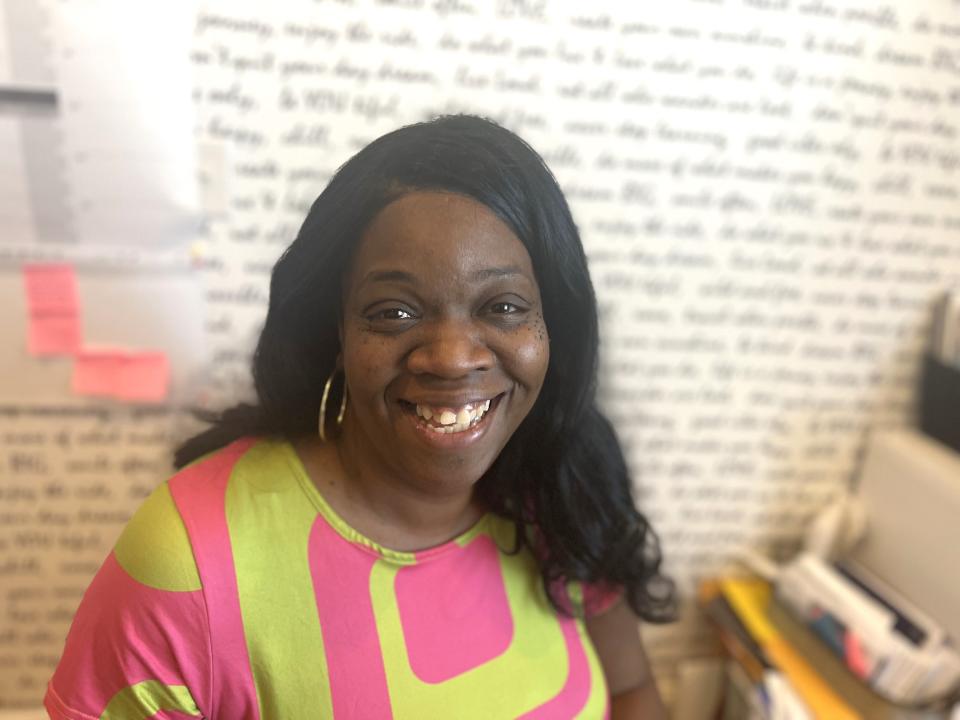 Latoya Barrett poses in front of her affirmation wall, located inside the office at her home in Wilmington. Barrett credits bariatric surgery with helping her get her energy back.