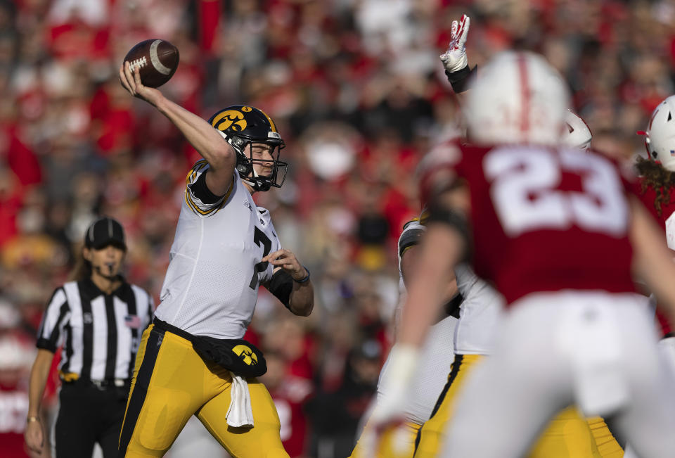 Iowa quarterback Spencer Petras (7) passes the ball against Nebraska during the second half of an NCAA college football game Friday, Nov. 26, 2021, at Memorial Stadium in Lincoln, Neb. Iowa defeated Nebraska 28-21. (AP Photo/Rebecca S. Gratz)