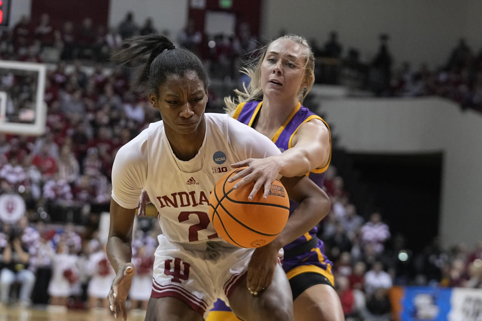 Indiana's Chloe Moore-McNeil (22) is defended by Tennessee Tech's Jordan Brock (2) during the first half of a first-round college basketball game in the women's NCAA Tournament Saturday, March 18, 2023, in Bloomington, Ind. (AP Photo/Darron Cummings)