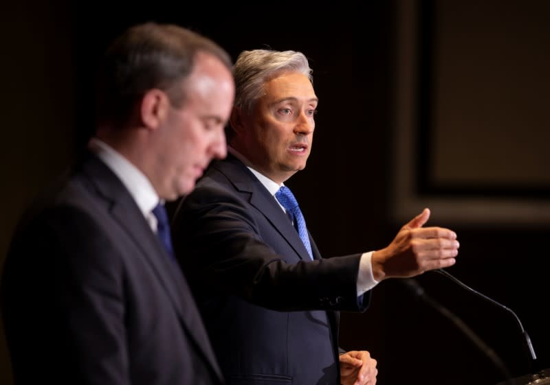 Canada's Francois-Philippe Champagne and Britain's Foreign Secretary Dominic Raab speak during a news conference in Montreal