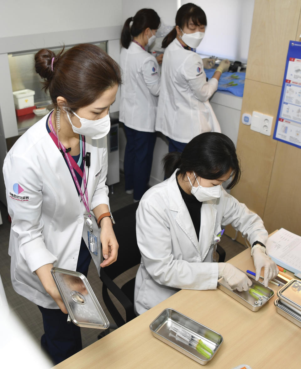 Nurses prepare for the first dose of the Pfizer BioNTech COVID-19 vaccine at the National Medical Center vaccination center in Seoul Saturday, Feb. 27, 2021. (Song Kyung-Seok/Pool Photo via AP)