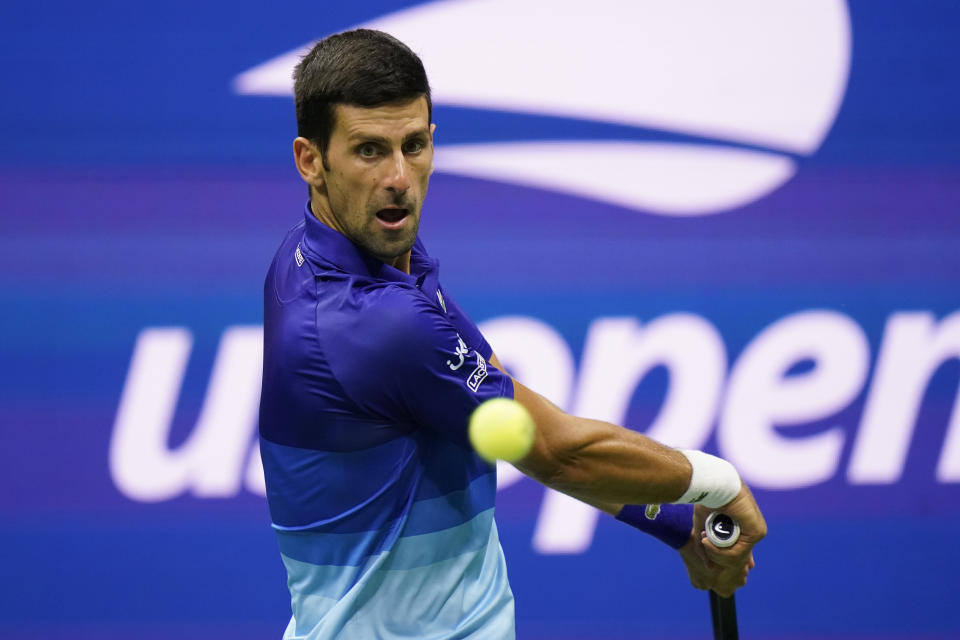 Novak Djokovic, of Serbia, returns a shot to Tallon Griekspoor, of the Netherlands, during the second round of the US Open tennis championships, Thursday, Sept. 2, 2021, in New York. (AP Photo/Frank Franklin II)