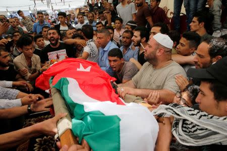 People attend the funeral of Mohammad Jawawdah in Amman, Jordan July 25, 2017. REUTERS/Muhammad Hamed.