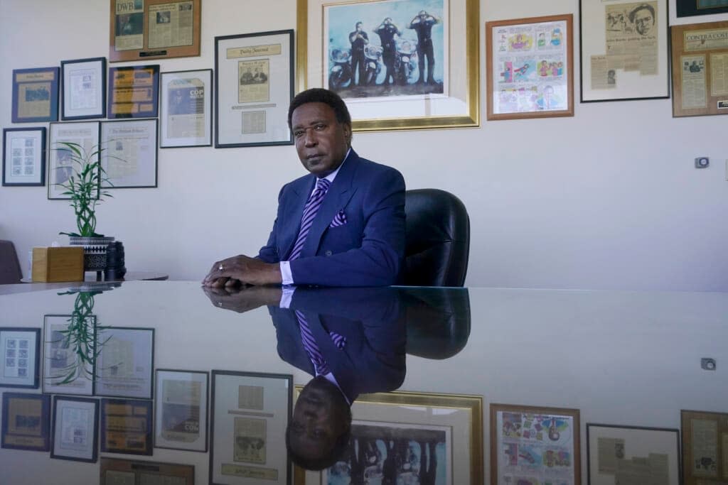 Attorney John Burris poses for photos at his office in Oakland, Calif., Tuesday, Aug. 16, 2022. For nearly 50 years, Burris has poked holes into narratives that did not add up, namely those of law enforcement accused of using excessive force. (AP Photo/Jeff Chiu)