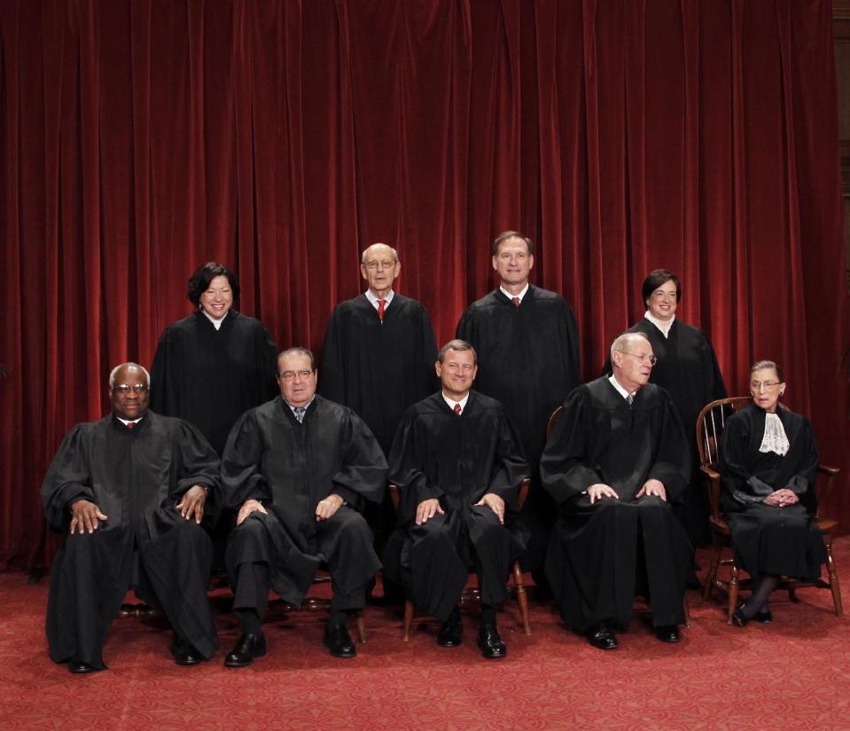FILE - This Oct. 8, 2010 file photo shows the justices of the U.S. Supreme Court in a group portrait at the Supreme Court Building in Washington. The Supreme Court is embarking on a new term beginning Monday, Oct. 1, 2012, that could be as consequential as the last one with the prospect for major rulings about affirmative action, gay marriage and voting rights. Seated from left to right are: Associate Justice Clarence Thomas, Associate Justice Antonin Scalia, Chief Justice John G. Roberts, Associate Justice Anthony M. Kennedy, Associate Justice Ruth Bader Ginsburg. Standing, from left are: Associate Justice Sonia Sotomayor, Associate Justice Stephen Breyer, Associate Justice Samuel Alito Jr., and Associate Justice Elena Kagan. (AP Photo/Pablo Martinez Monsivais)
