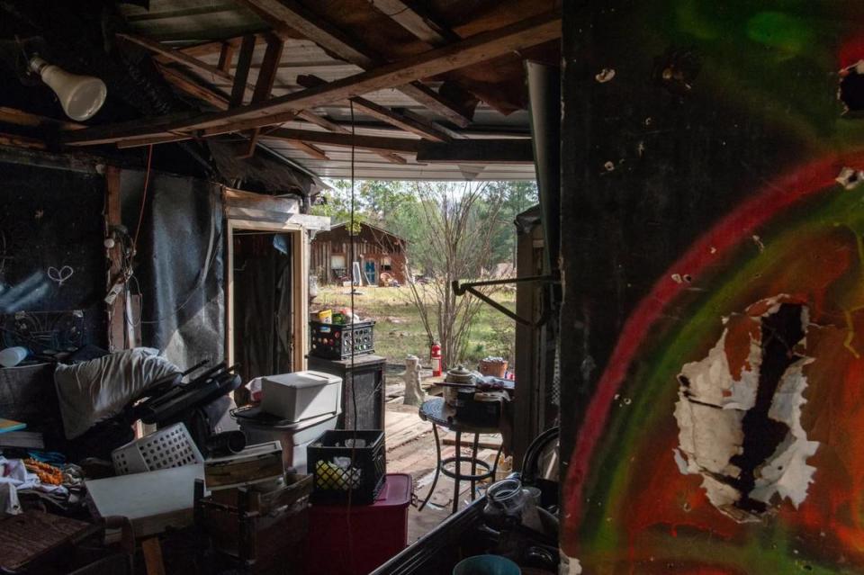 A home remains abandoned following fire damage in the Robinhood neighborhood near Brandon, Mississippi., on Nov. 24, 2023. The previous occupants allege the Rankin County Sheriff’s Department frequently harassed them at the property.